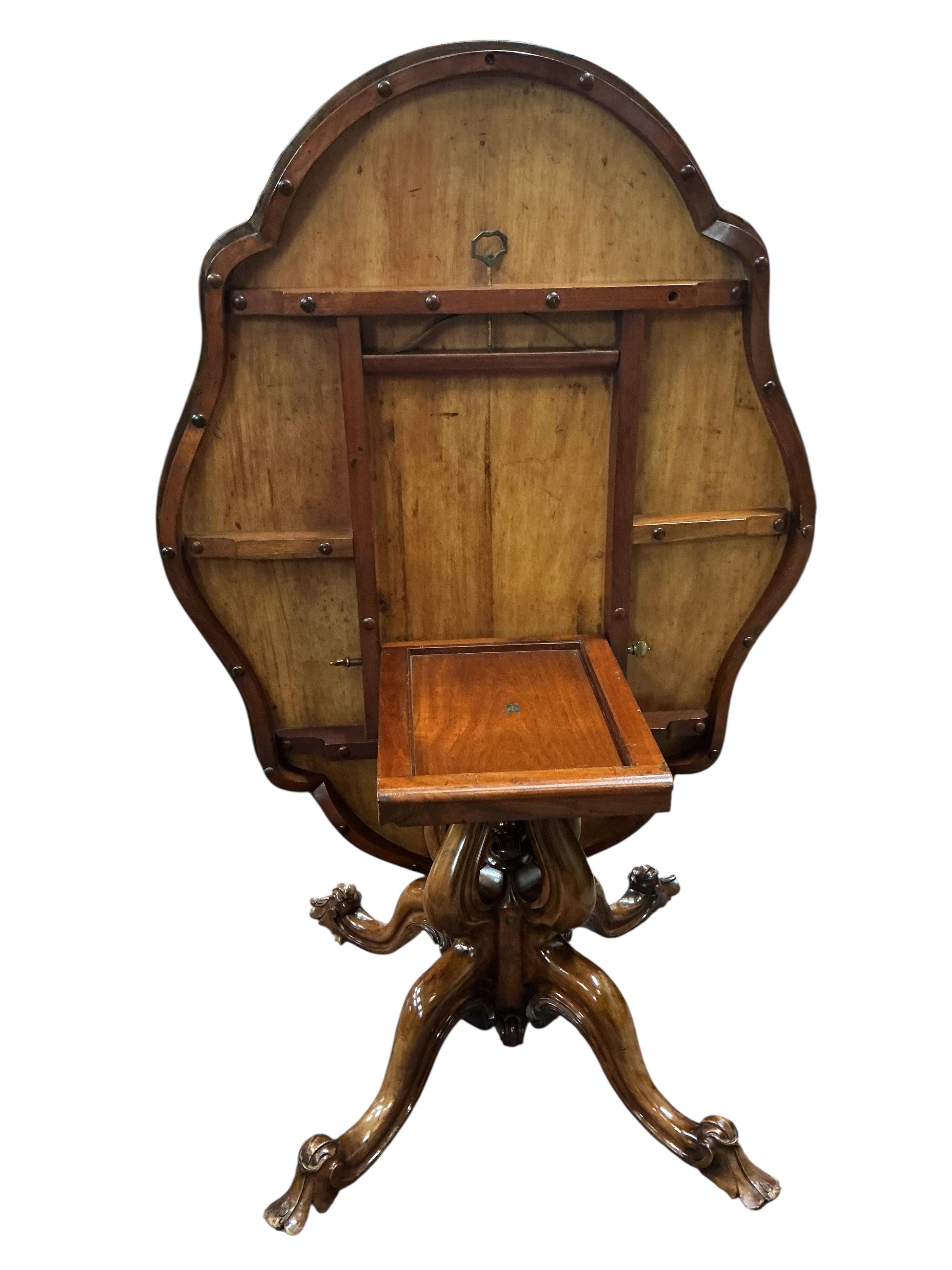 A Victorian oval burr walnut tilt top loo table, width 114cm, depth 146cm, height 74cm